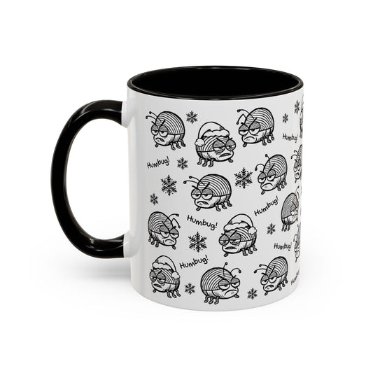 Mug with black and white 'Humbug!' beetle pattern on a white background with contrasting black interior and handle.